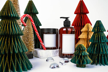 dark jar with lid and dispenser on the background of Christmas decorations, side view