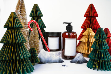 dark jar with lid and dispenser on the background of Christmas decorations, side view