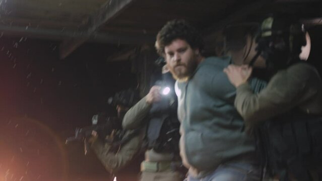 Police moving arrested criminal towards police car