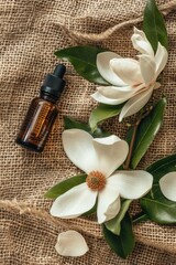 Magnolia essential oil on burlap background