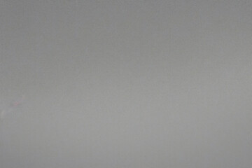 Superficie de plástico lisa de color gris mate con textura fina y viñeta en el lado derecho. Fondo texturizado exquisito, fondo suave en blanco	
