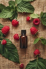 raspberry essential oil on burlap background