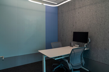 Interior of modern empty office building.Open ceiling design.Equipped with automatic lifting table and LCD screen.