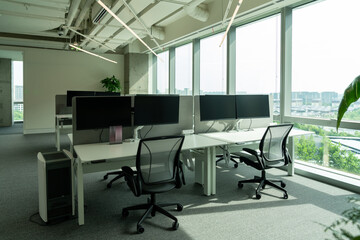 Interior of modern empty office building.Open ceiling design.Equipped with automatic lifting table and LCD screen.