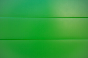 Green flat background of plastic planks.