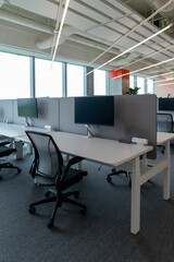 Interior of modern empty office building.Open ceiling design.Equipped with automatic lifting table and LCD screen.