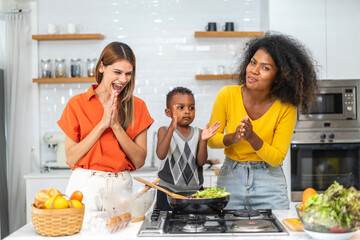 Diversity young happy love LGBT, LGBTQ caucasian and african family lesbian couple woman cook vegan...
