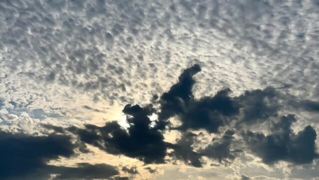 Moving Cloud, time-lapse,  Sky with sun and dark clouds background.