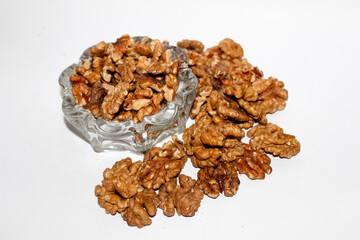 A delicious and healthy snack, a selection of fresh walnuts on a clean white background. Perfect for use in food, health, and wellness projects