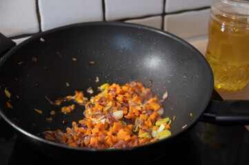 wok pan with finely chopped vegetables