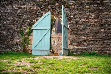 View of the keep of Castle Park Rochefort en Terre through a half-open door, Photograph taken in Brittany, France.