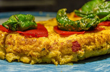 Spanish tortilla, decorated with peppers