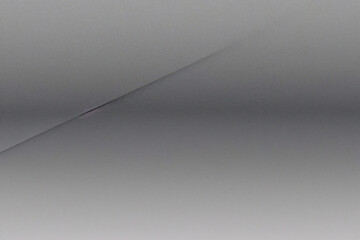 マットグレーの滑らかなプラスチックの表面に細かい質感があり、右側にビネットが付いています。絶妙なテクスチャ背景、柔らかい空白の背景