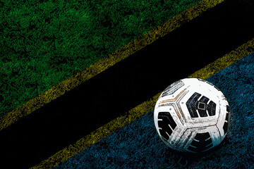 Football ball and field with Tanzania flag, tournament or competition, victory and win concept