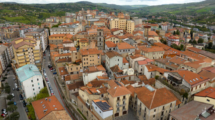 Fototapeta na wymiar Aerial view of the historic center of the city of Potenza, in Basilicata, Italy. The houses in the old town have traditional red sloping roofs.