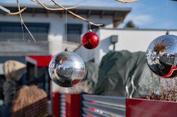 Beautiful New Year's  colorful balls, red and silver decoration outside on the street
