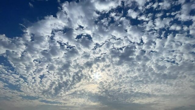Timelapse Sun Beams Shining Through Moving Dramatic White Clouds.