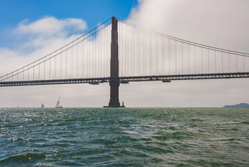 Magnificent Golden Gate Bridge view in San Francisco, California, from water level. Iconic bridge...