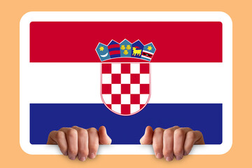 Naklejka premium Hands holding a white frame with Croatia flag, two hands and frame, celebration or campaigning 