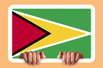 Hands holding a white frame with Guyana flag, protest or social issues in Guyana, two hands and 