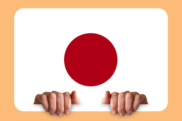 Hands holding a white frame with Japan flag, celebration or campaigning concept, two hands and 