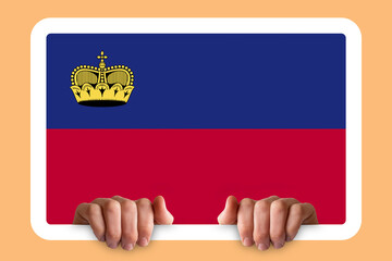 Hands holding a white frame with Liechtenstein flag, two hands and frame, independence day idea - obrazy, fototapety, plakaty