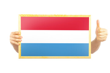 Hands holding a frame with Luxembourg flag, independence day idea, celebration or victory concept