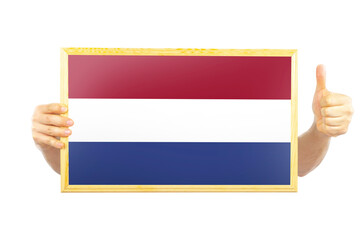 Hands holding a frame with Netherlands flag, independence day idea, celebration or victory concept