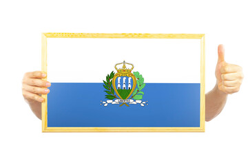 Hands holding a frame with San Marino flag, celebration or victory concept, independence day idea