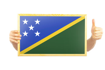 Hands holding a frame with Solomon Island flag, two hands and thumb up, independence day idea