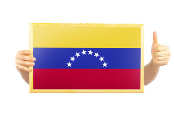 Hands holding a frame with Venezuela flag, celebration or victory concept, two hands and thumb 