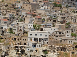 City, houses in the rocks. Cappadocia. Ancient architecture. Tourism. Türkiye.