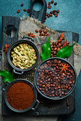 Preparation of aromatic coffee with cardamom and anise. Arabica or robusta coffee. Coffee background.