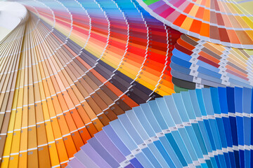 Color wheel for choosing paint tone.Painter and decorator work table, color swatches
