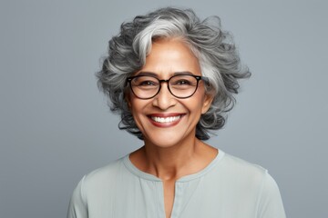 Fototapeta premium Portrait of a smiling senior woman of Indian ethnicity