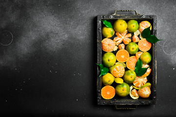 A box of ripe tangerines. Citrus fruits are rich in vitamin C. Autumn fruits.