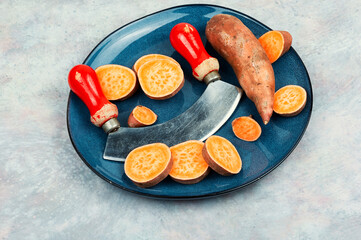 Uncooked sweet potato yams, healthy eating concept.