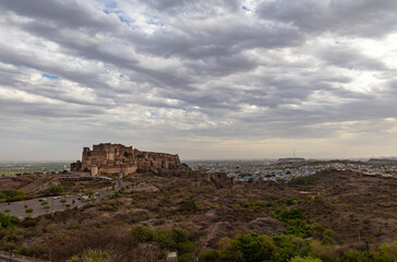 Fototapeta na wymiar ancient historical fort with dramatic cloudy sky at evening from flat angle