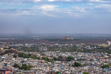 city with historical place and misty sky at evening from mountain top