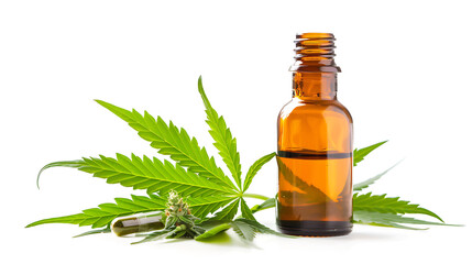Cannabis essential oil in a small bottle with hemp leaves.