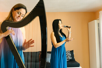Harp and voice duo rehearsing together