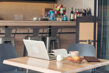 Banner Office laptop business financial document chart and graph on office wooden table coffee cup. Panorama Flat lay notebook computer laptop on office desk. Business stuff mockup with copy space