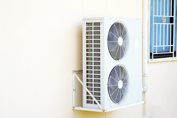 home air conditioner coil or condenser with 2 blades with motor installed outside the building...