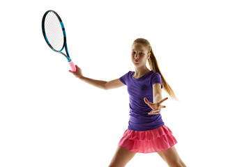 Contemplative. Sportive fit teenage girl, tennis player in vibrant uniform ready to hit ball...