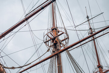 Large sailboat with high masts. A beautiful old ship in the port of Genoa. Liguria, Italy
