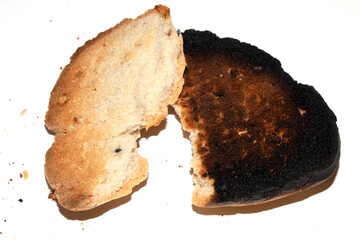 Very Burnt Bread Roll Torn or Cut in Half Toast Close Up Texture