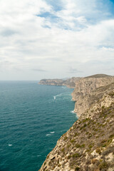 Fototapeta premium Panoramic view, cliffs and Mediterranean sea on a cloudy morning day, in Jávea, Alicante (Spain).