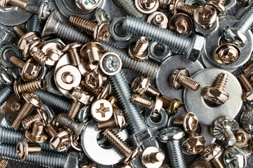 Mixed screws and nails. Industrial background. Home improvement.bolts and nuts.Close-up of various screws. Use for background, top view.