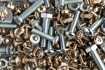 Mixed screws and nails. Industrial background. Home improvement.bolts and nuts.Close-up of various screws. Use for background, top view.