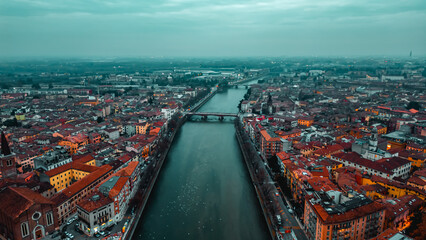City of Verona and Adige river aerial view Veneto region, Italia. Red tiled roofs. Traditional...